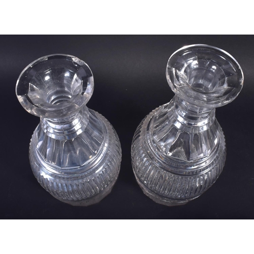 27 - A PAIR OF GEORGE III CUT GLASS DECANTERS. 22 cm high.