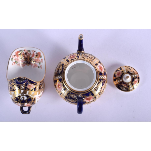 288 - Royal Crown Derby miniature teapot  and spoon stand painted with pattern 6299, date code 1907 & 1913... 