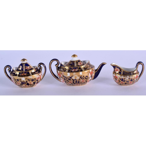 289 - Royal Crown Derby miniature tea set: teapot and cover, sucrier and cover and milk jug pattern 2451, ... 