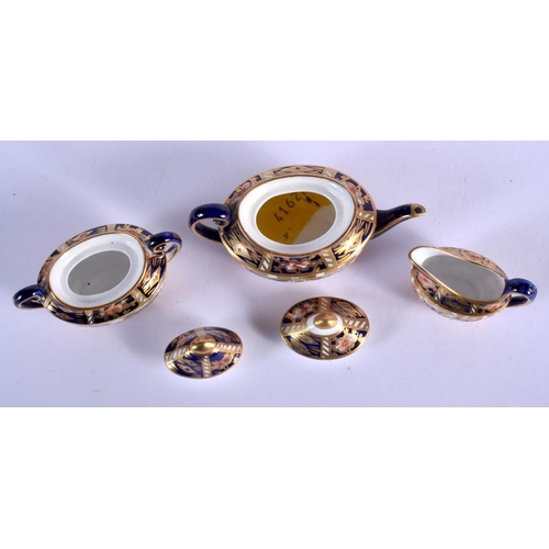 289 - Royal Crown Derby miniature tea set: teapot and cover, sucrier and cover and milk jug pattern 2451, ... 