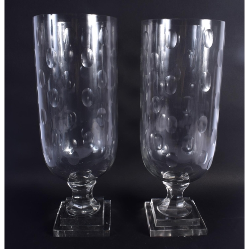 29 - A LARGE PAIR OF CUT GLASS STORM CELERY VASES. 40 cm high.