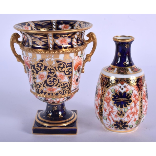 290 - Royal Crown Derby two handled vase painted with pattern 6299, date code 1918 and a smaller vase pain... 