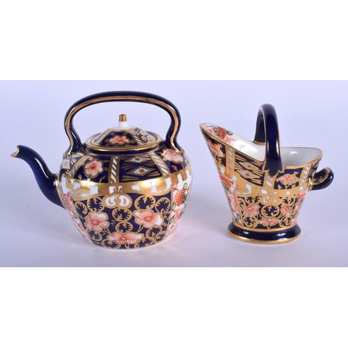 292 - Royal Crown Derby miniature kettle and coal scuttle painted with pattern 6299, date code 1914 & 1918... 