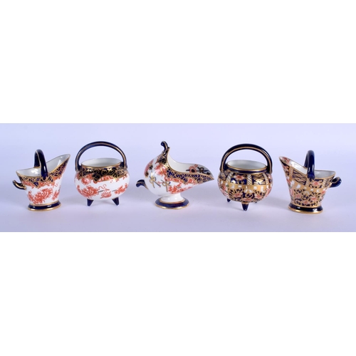 293 - Royal Crown Derby miniatures: two coal scuttles two cauldrons and a spoon stand with either pattern ... 