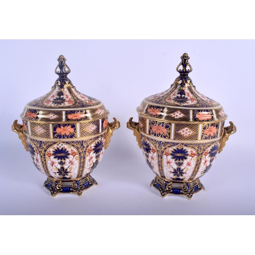 297 - Royal Crown Derby superb pair of two handled vases and covers painted with pattern 1128, date code 1... 