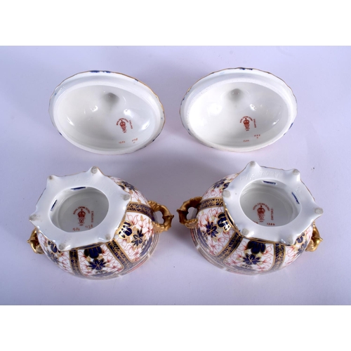 297 - Royal Crown Derby superb pair of two handled vases and covers painted with pattern 1128, date code 1... 