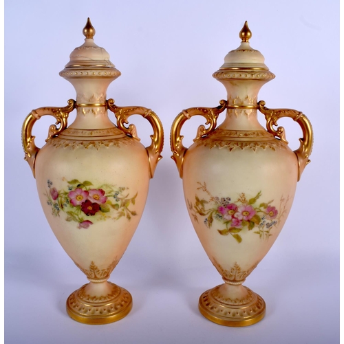 309 - Royal Worcester pair of two handled blush ivory vases and covers painted with roses, date mark 1919,... 