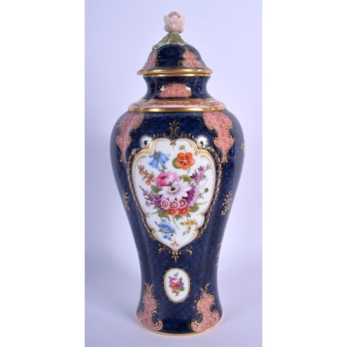 311 - Royal Worcester vase and cover painted with flowers on a blue scale ground with red cell panels by E... 