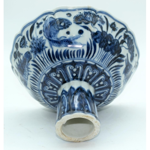 3161 - A Chinese blue and white stem cup decorated with fish. 17 x 11cm.