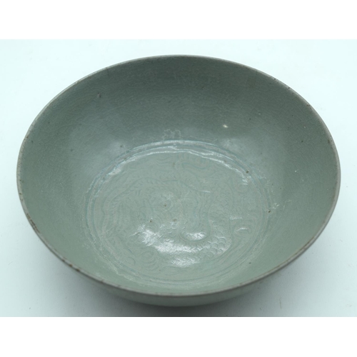 3162 - A Chines Ru ware bowl decorated with a dragon in relief 5 x 17cm.