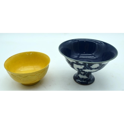 3163 - A Chinese blue and white stem cup together with a yellow ground bowl 10 x 16cm (2).