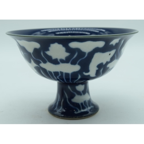 3163 - A Chinese blue and white stem cup together with a yellow ground bowl 10 x 16cm (2).