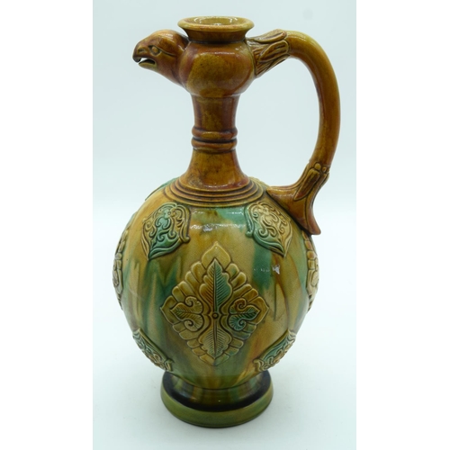 3164 - A Chinese wine vessel with a birds head handle 36 x 18cm.