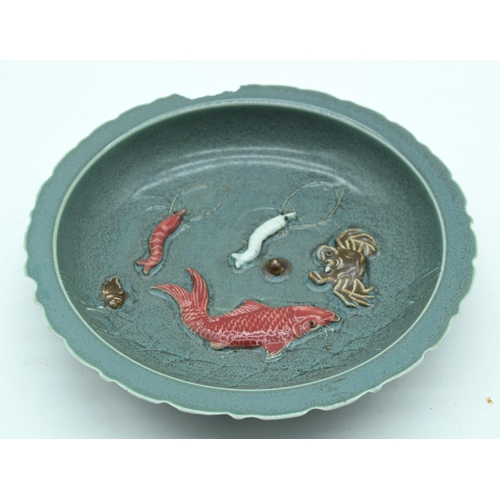 3166 - A Chinese bowl decorated with sea creatures. 22cm.