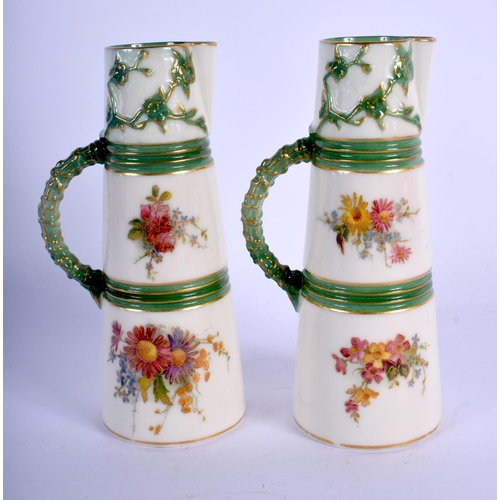 330 - Royal Worcester pair of unusually small size claret jugs painted and gilded with flowers, the mouldi... 