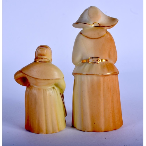 334 - Royal Worcester two blush ivory candlesnuffer: French Cook, date mark 1912, Nun date mark 1919.  9.5... 