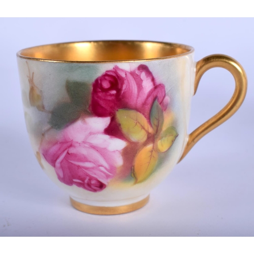 349 - Royal Worcester coffee cup and saucer painted with roses date mark 1927.  Cup 5cm high and Saucer 9.... 