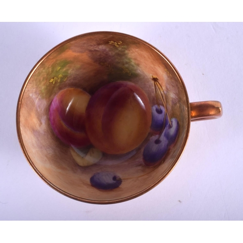 360 - Royal Worcester demi-tasse cup and saucer painted with fruit, the saucer by J. Freeman, signed, the ... 