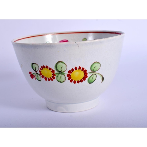 426 - AN 18TH CENTURY ENGLISH PEARLWARE TEABOWL AND SAUCER painted with flowers. 8 cm diameter.