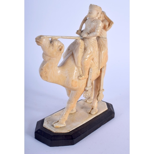 468 - A 19TH CENTURY MIDDLE EASTERN CARVED IVORY FIGURE OF A ROAMING CAMEL modelled with two attendants. 1... 