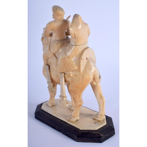 468 - A 19TH CENTURY MIDDLE EASTERN CARVED IVORY FIGURE OF A ROAMING CAMEL modelled with two attendants. 1... 