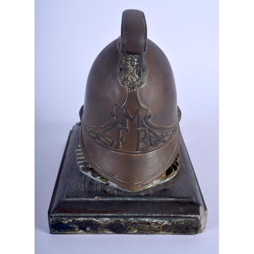 469 - AN ANTIQUE BRONZE FIRE BRIGADE PAPERWEIGHT. 14 cm x 14 cm.