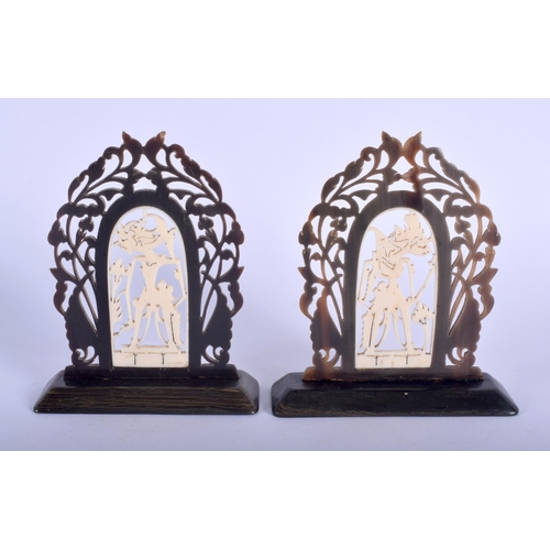 479 - A VERY RARE PAIR OF 19TH CENTURY ANGLO INDIAN CARVED RHINOCEROS HORN BOOKENDS inset with ivory deiti... 