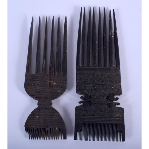 487 - TWO EARLY 20TH CENTURY CARVED TRIBAL PRONGED COMBS. 18 cm x 6 cm. (2)