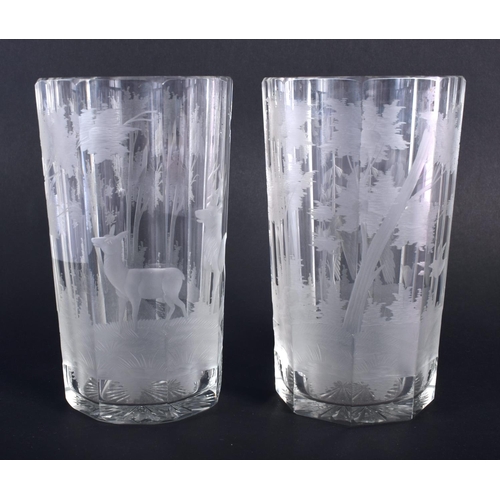 5 - A PAIR OF BOHEMIAN ENGRAVED GLASSES decorated with birds and landscapes. 15 cm high.