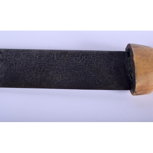 502 - A 19TH CENTURY INDIAN MIDDLE EASTERN CARVED HORN HANDLED KNIFE decorated all over with Kufic script.... 