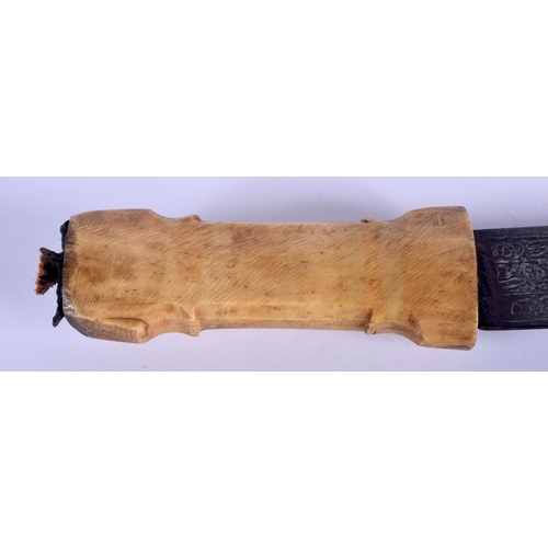 502 - A 19TH CENTURY INDIAN MIDDLE EASTERN CARVED HORN HANDLED KNIFE decorated all over with Kufic script.... 