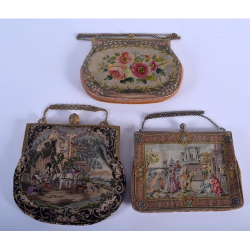 518 - THREE CONTINENTAL VINTAGE NEEDLEPOINT PURSES one with enamelled banding. 18 cm x 13 cm. (3)