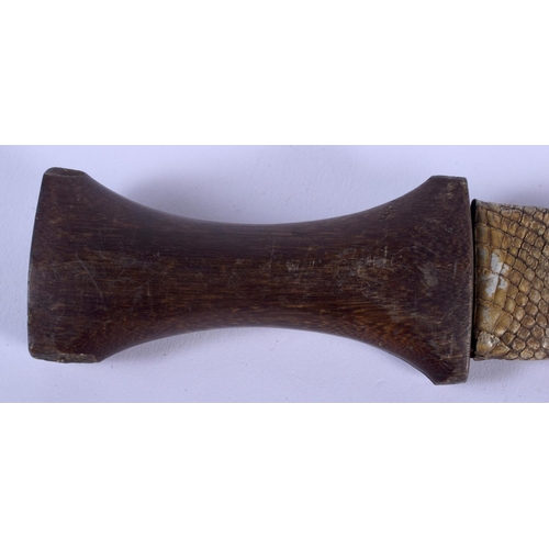 520 - AN ANTIQUE NORTH AFRICAN CARVED RHINOCEROS HORN HANDLED KNIFE. 26 cm long.