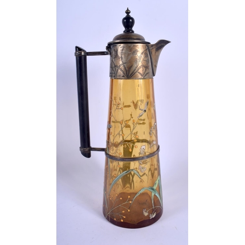 529 - A RARE AESTHETIC MOVEMENT ENAMELLED AMBER GLASS CLARET JUG painted with butterflies and foliage. 30 ... 