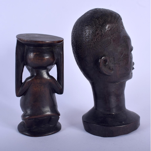 565 - AN EARLY 20TH CENTURY AFRICAN CARVED WOOD TRIBAL SCARIFIED HEAD together with another. Largest 18 cm... 