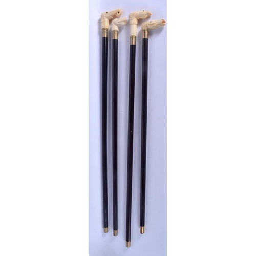 587 - FOUR CONTINENTAL CARVED BONE WALKING CANES with ebonised shafts. Largest 95 cm long. (4)