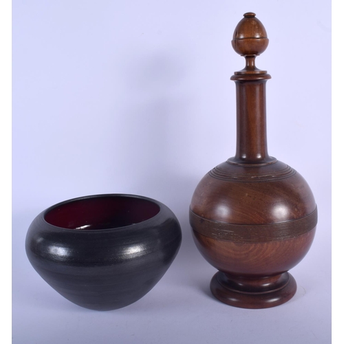 590 - A LARGE ANTIQUE TREEN VASE AND COVER together with a vintage bowl. Largest 34 cm high. (2)