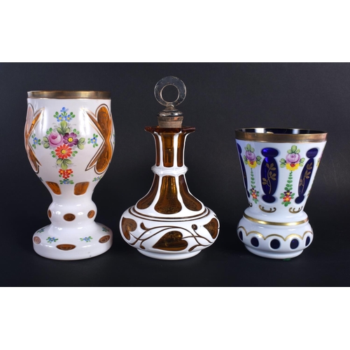 6 - A BOHEMIAN ENAMELLED GLASS GOBLET together with two others. Largest 18 cm high. (3)