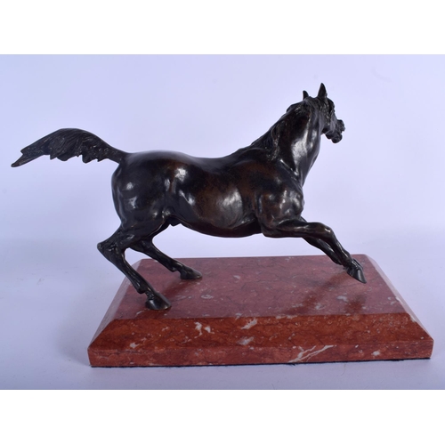 619 - A CONTEMPORARY BRONZE FIGURE OF A HORSE upon a red marble plinth. 22 cm x 18 cm.