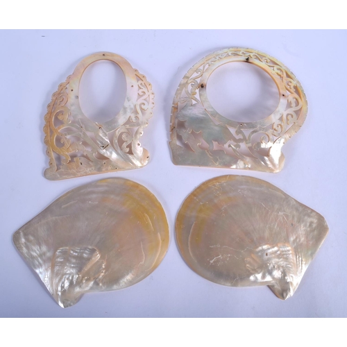 620 - TWO 19TH CENTURY MIDDLE EASTERN CARVED MOTHER OF PEARL SHELLS together with two others. Largest 18 c... 