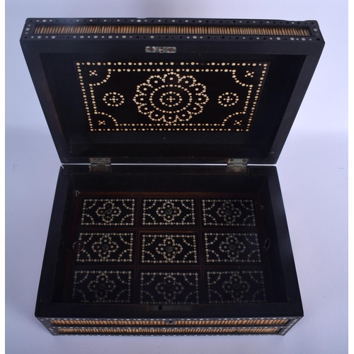 634 - A 19TH CENTURY ANGLO INDIAN PORCUPINE QUILL CASKET the lid rising to reveal a fitted interior. 30 cm... 