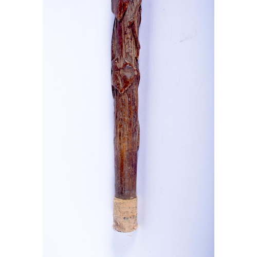 638 - A 19TH CENTURY BAVARIAN BLACK FOREST CARVED WOOD WALKING CANE with rare inscription to the top. 78 c... 