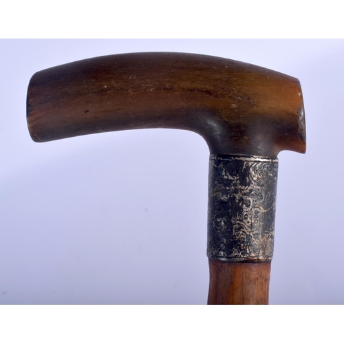 641 - A 19TH CENTURY CONTINENTAL CARVED RHINOCEROS HORN HANDLED WALKING CANE. 88 cm long.