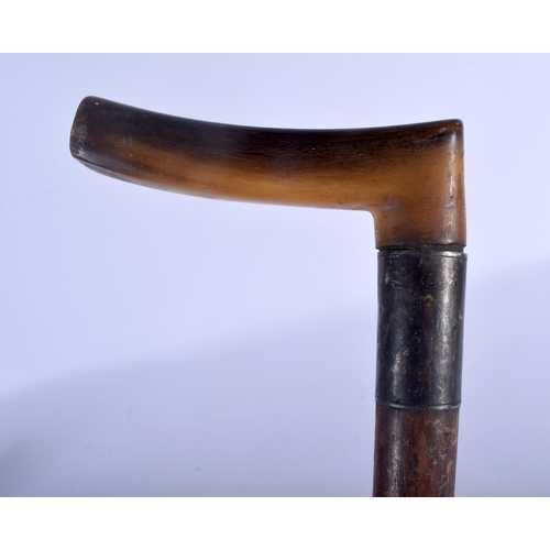 644 - A 19TH CENTURY CONTINENTAL CARVED RHINOCEROS HORN HANDLED WALKING CANE. 88 cm long.