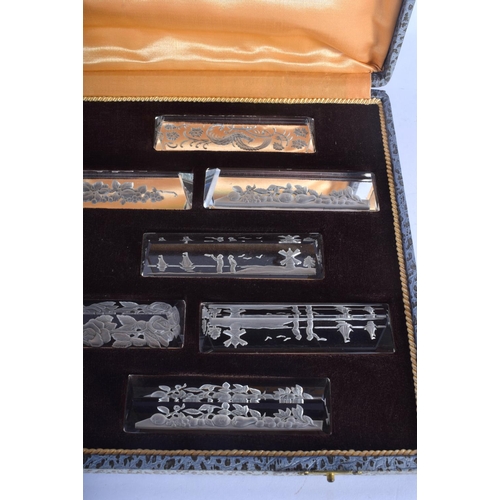 659 - A CASED SET OF VINTAGE FRENCH CRYSTAL GLASS KNIFE RESTS possibly Baccarat. 10.5 cm wide. (12)