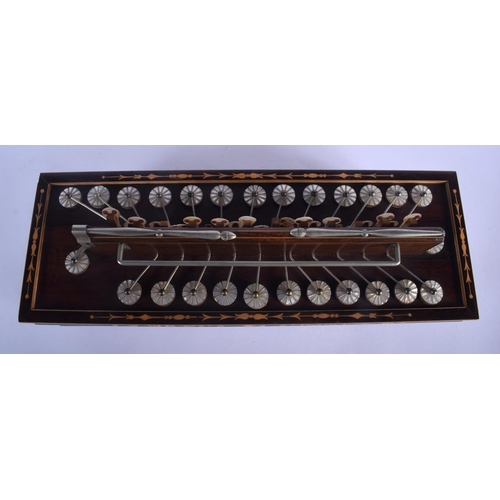 661 - AN ANTIQUE WALNUT INLAID CONCERTINA TYPE INSTRUMENT. 40 cm x 15 cm.