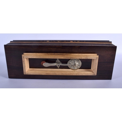 661 - AN ANTIQUE WALNUT INLAID CONCERTINA TYPE INSTRUMENT. 40 cm x 15 cm.