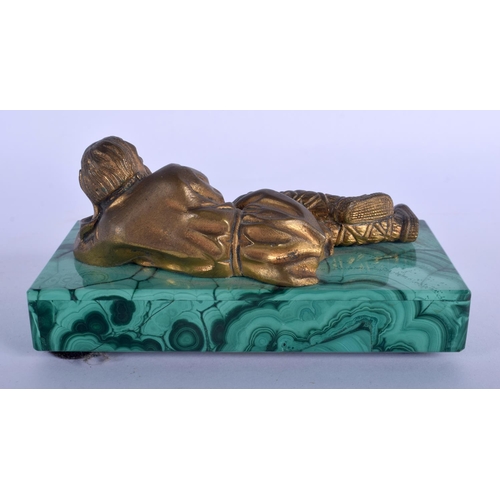 663 - A RARE 19TH CENTURY RUSSIAN GILT BRONZE FIGURE OF A RECLINING MALE modelled upon a malachite base. 1... 