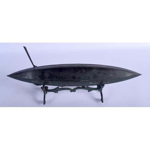 667 - AN EARLY 20TH CENTURY ITALIAN MODEL OF A GONDOLA modelled with a male holding an oar. 44 cm x 22 cm.