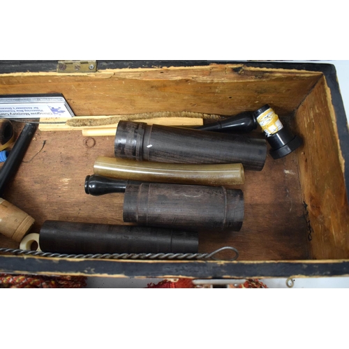 671 - A CASED SET OF VINTAGE SCOTTISH BAGPIPES within fitted box. 46 cm long.